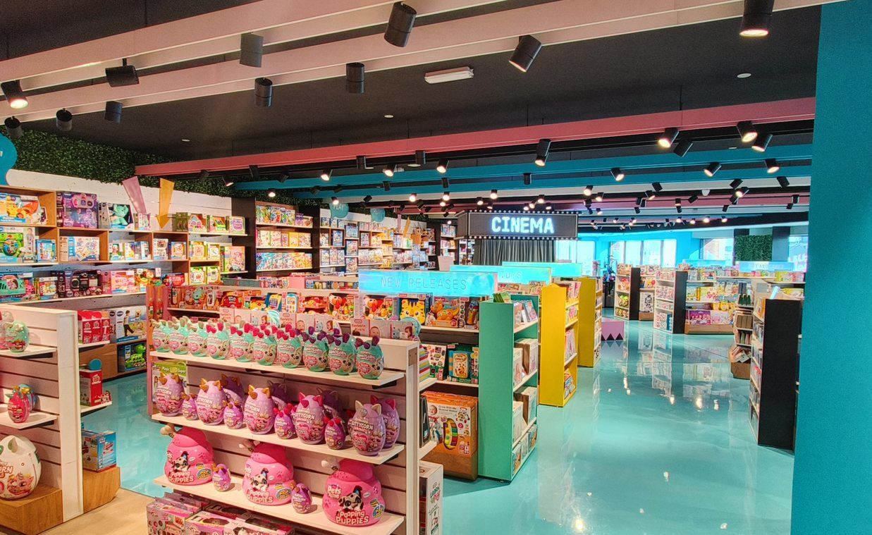 Retail store interior with custom shelving and a cinema-style feature, fitted out by PROJECTA